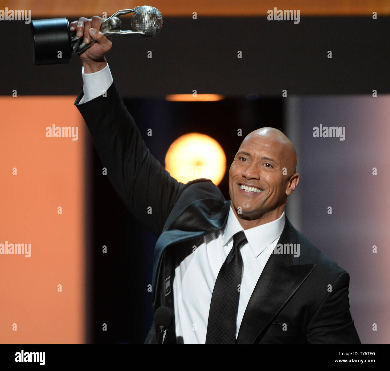Actor Dwayne Johnson accepts the award for Entertainer of the Year ...