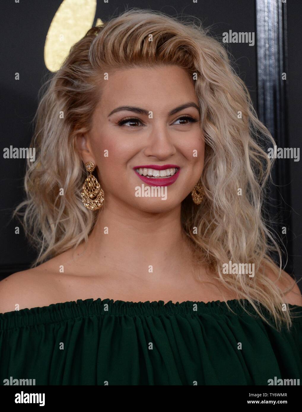 Singer/Songwriter Tori Kelly arrives for the 59th annual Grammy Awards