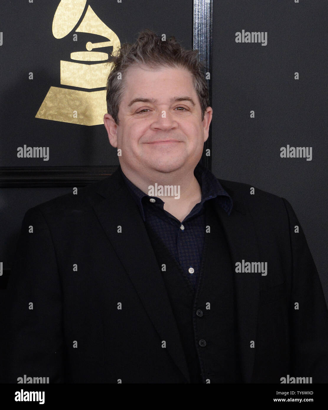 Comedian Patton Oswalt arrives for the 59th annual Grammy Awards held