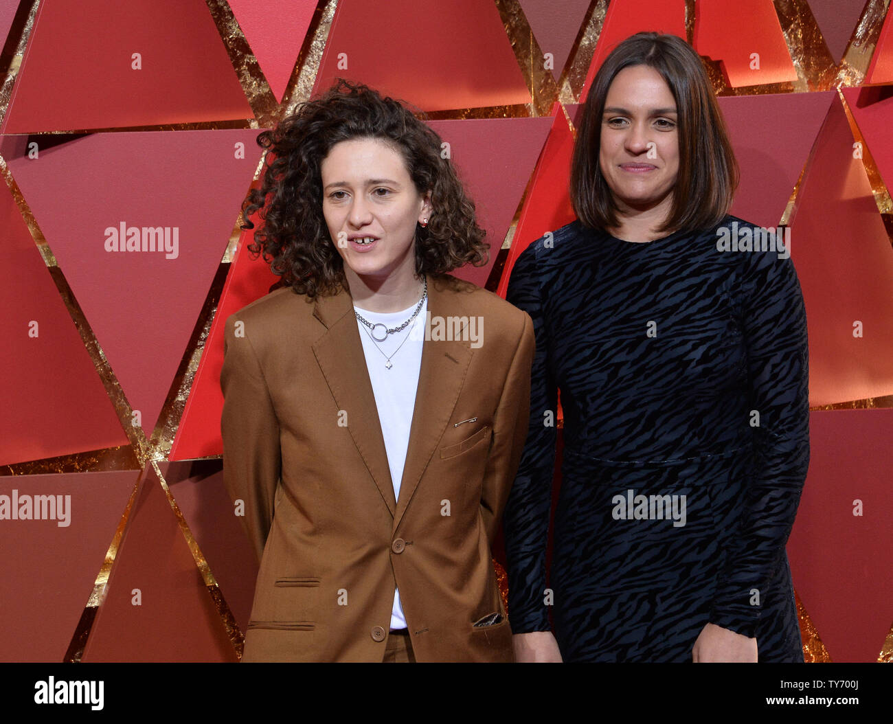 Composer Mica Levi and guest arrive on the red carpet for the 89th annual  Academy Awards at the Dolby Theatre in the Hollywood section of Los Angeles  on February 26, 2017. Photo