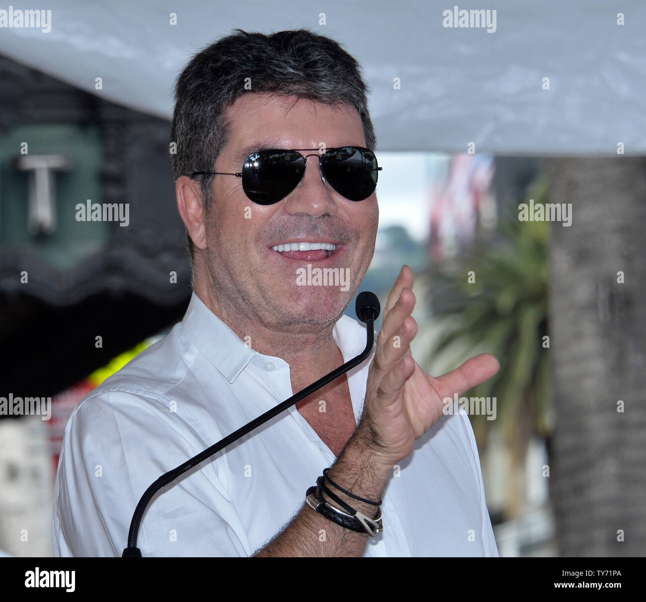 Simon Cowell makes comments during an unveiling ceremony honoring