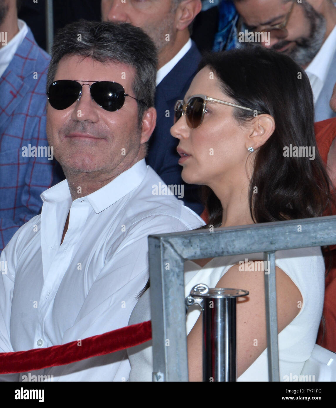 Simon Cowell and his partner Lauren Silverman attend an unveiling
