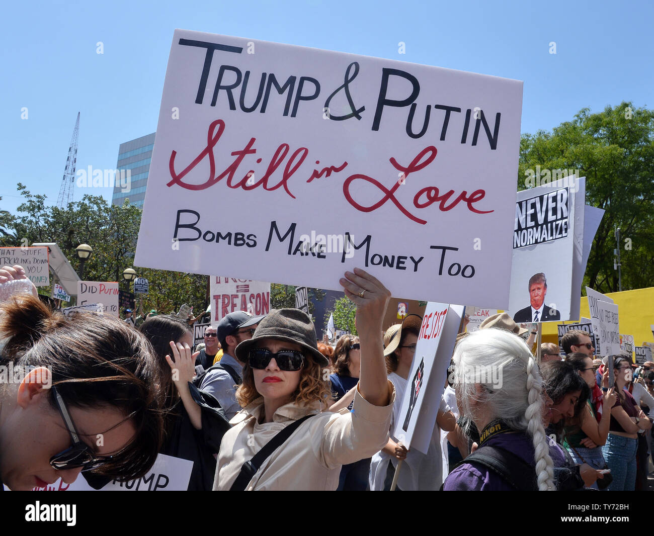 Thousands of people participate in the Tax March, in conjunction with ...