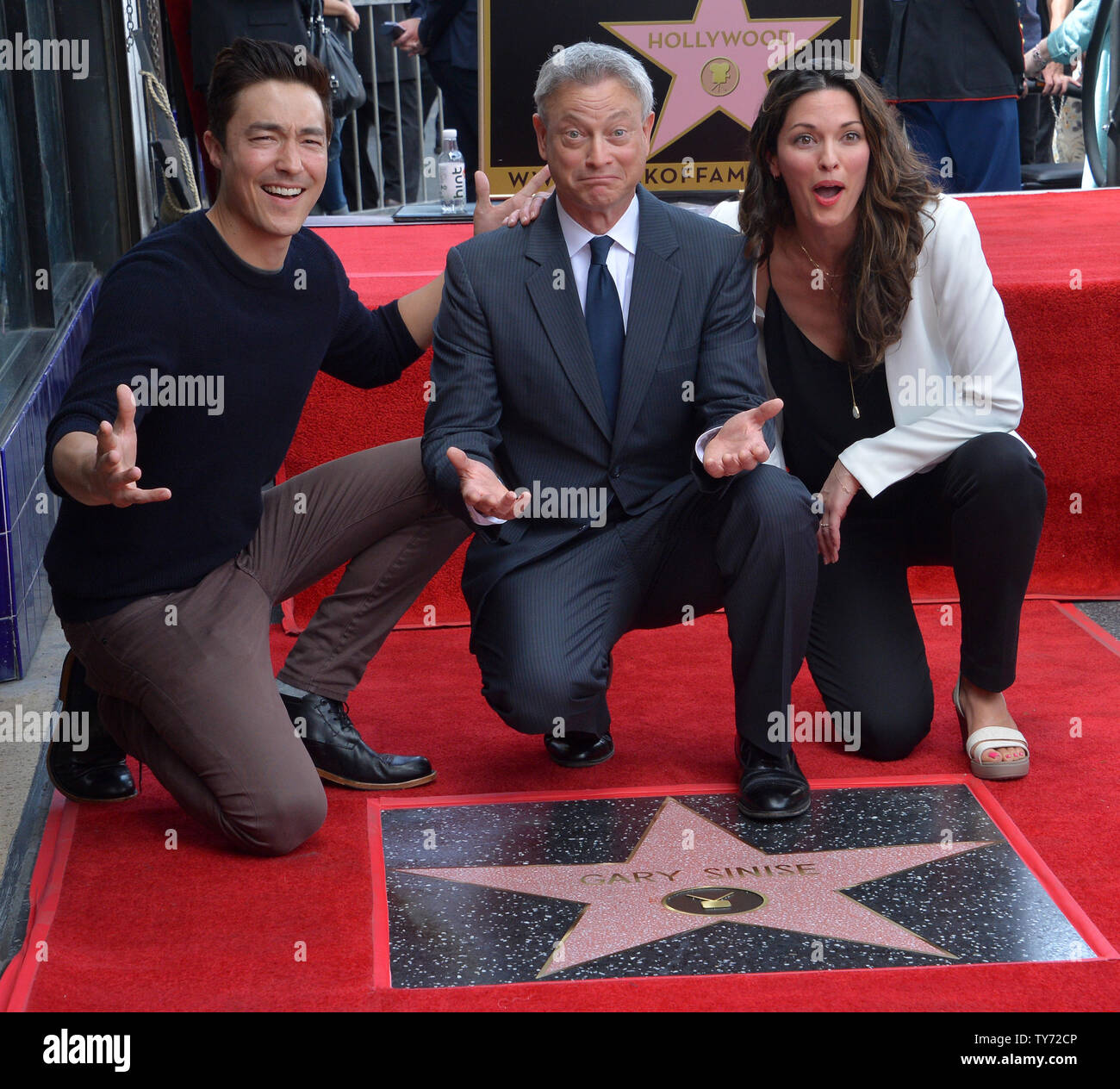 Actor and director Gary Sinise (C) is joined by actors Daniel Henney (L) and Alana de la Garza during an unveiling ceremony honoring him with the 2,606th star on the Hollywood Walk of Fame in Los Angeles on April 17, 2017.  Photo by Jim Ruymen/UPI Stock Photo