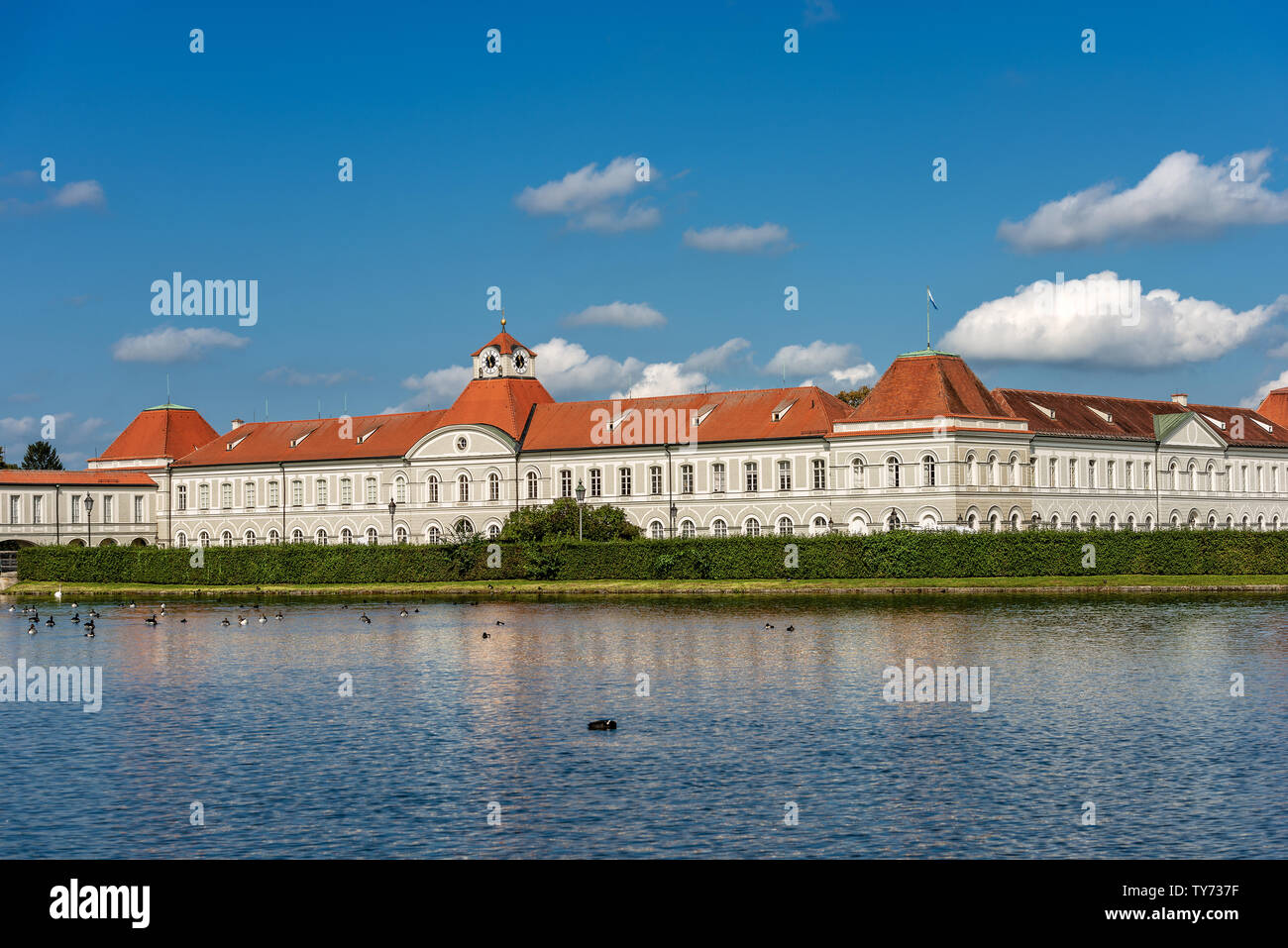 Nymphenburg Palace (Schloss Nymphenburg - Castle of the Nymphs) with the lake or pond. The palace was the residence of the former rulers of Bavaria Stock Photo