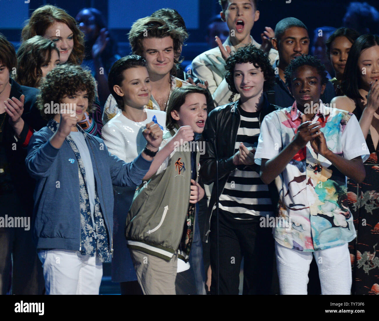 Actors Gaten Matarazzo, Charlie Heaton, Noah Schnapp, Natalia Dyer, Shannon Purser, Millie Bobby Brown, Finn Wolfhard, Joe Keery, and Caleb McLaughlin (L-R) accept the Show of the Year for 'Stranger Things' onstage during the MTV Movie & TV Awards at the Shrine Auditorium in Los Angeles on May 7, 2017. It will be the 26th edition of the awards, and will for the first time present honors for work in television as well as cinema.  Photo by Jim Ruymen/UPI Stock Photo
