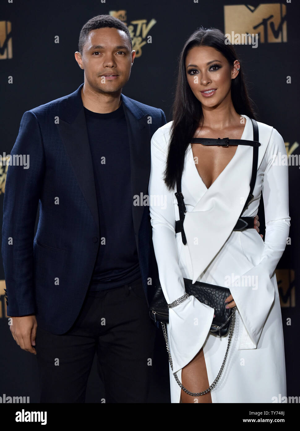 TV personality Trevor Noah (L) and singer Jordyn Taylor attend the 