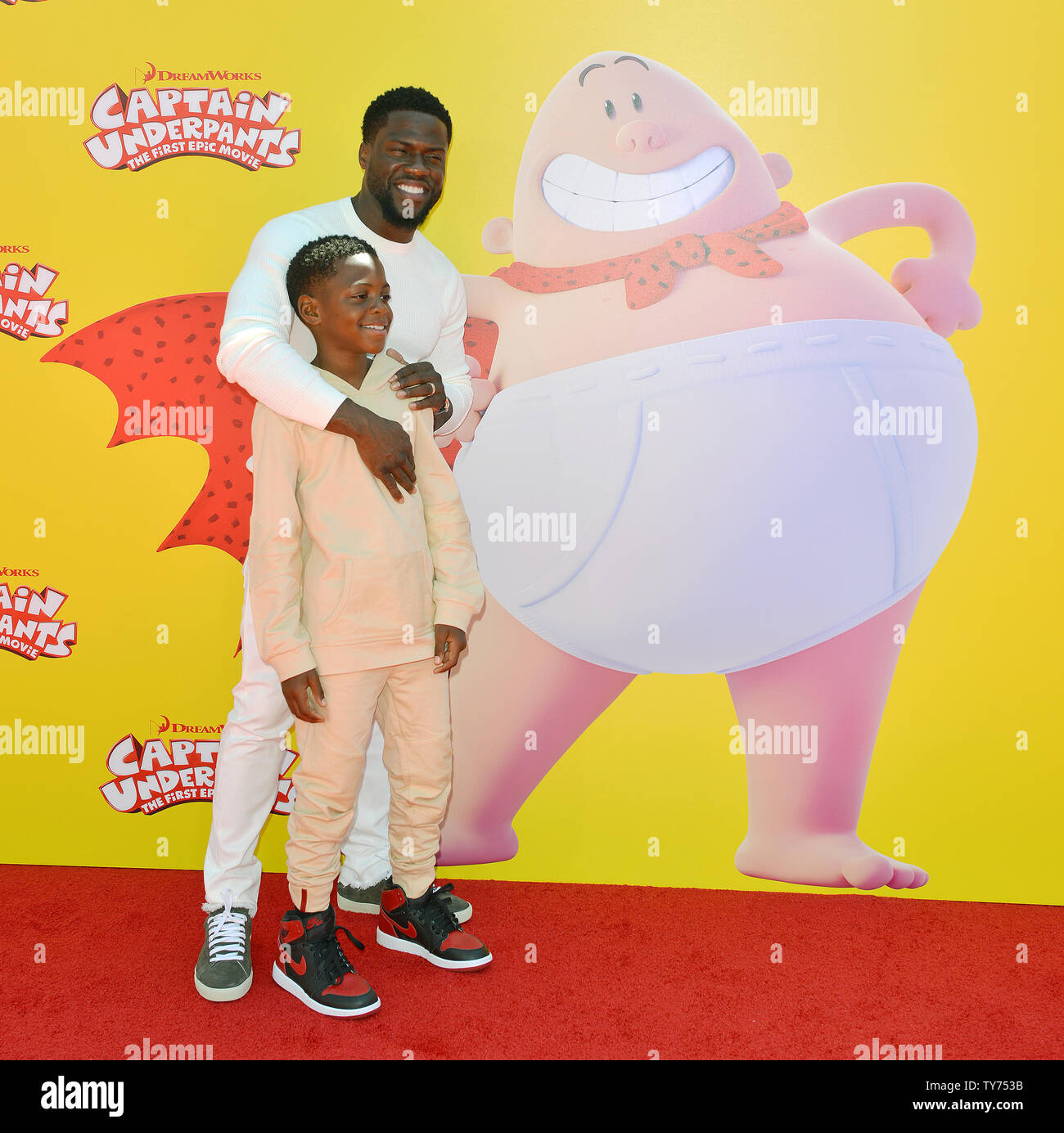Kevin Hart and his son Hendrix arrive at the premiere of 'Captain