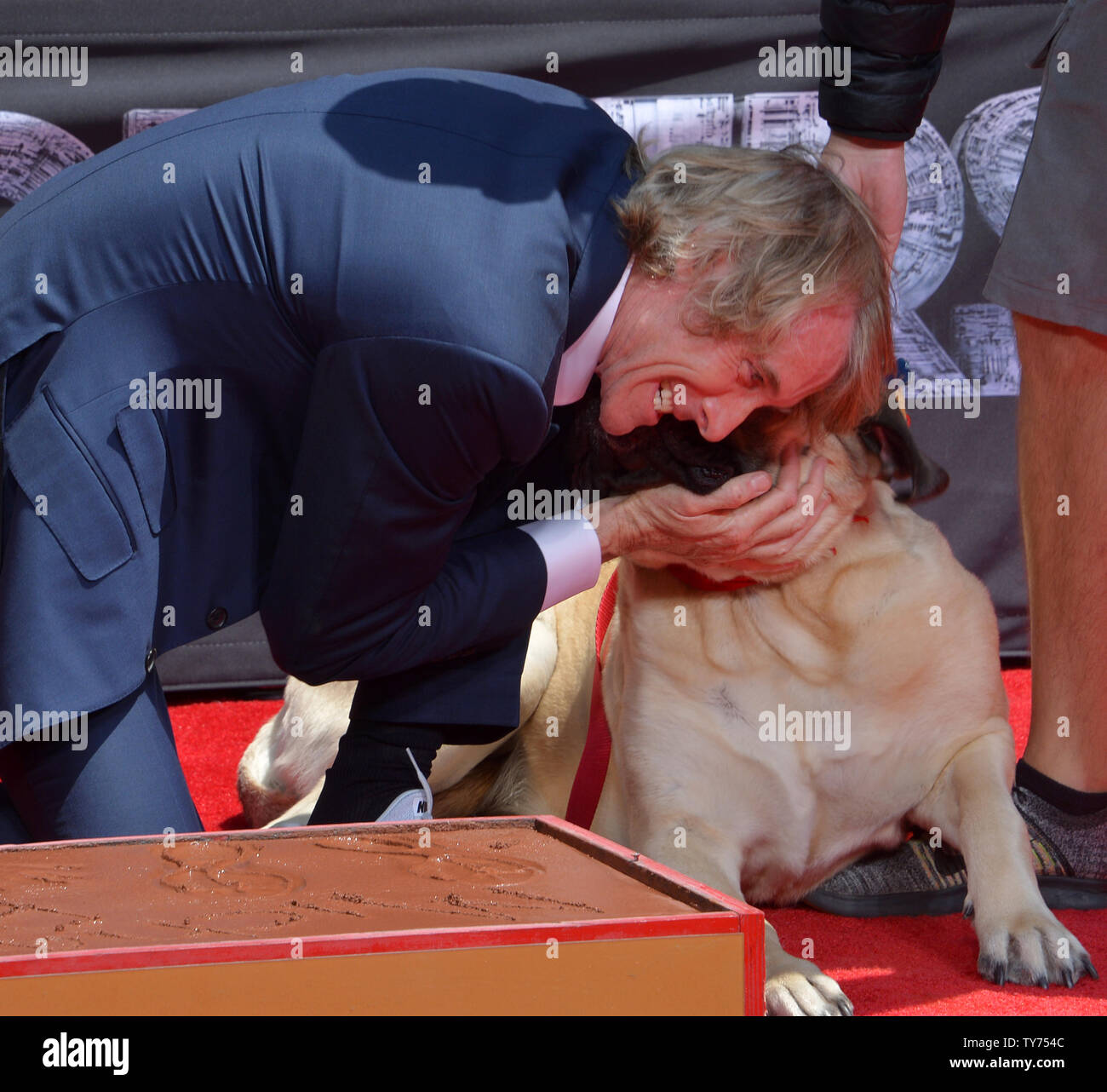 Director Michael Bay is joined by his dog Rebel during a hand and footprint ceremony immortalizing him in the forecourt of TCL Chinese Theatre (formerly Grauman's) in the Hollywood section of Los Angeles on May 23, 2017. Photo by Jim Ruymen/UPI Stock Photo