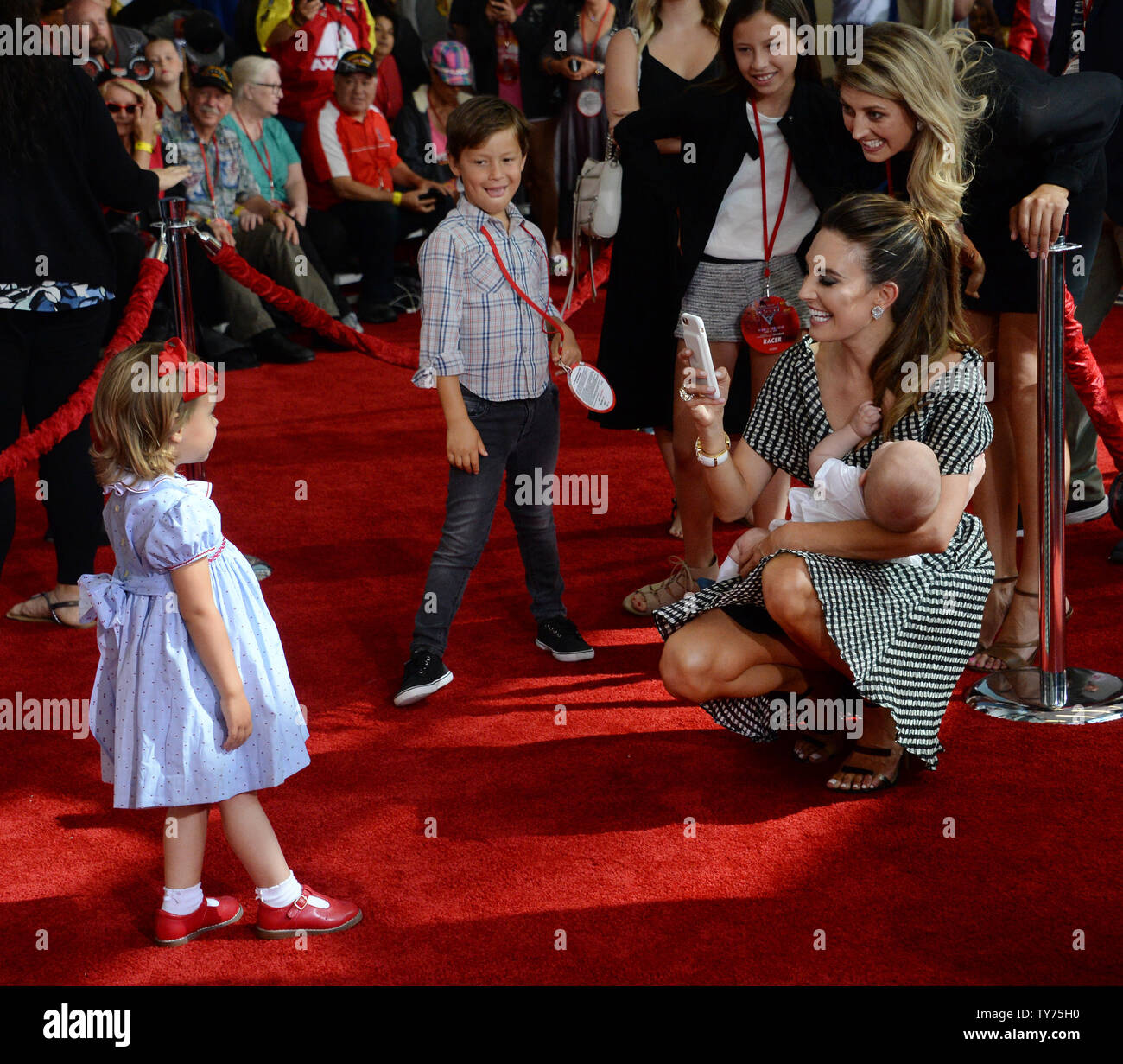 Actress Elizabeh Chambers takes a photo of daughter Harper Hammer while holding Ford Hammer