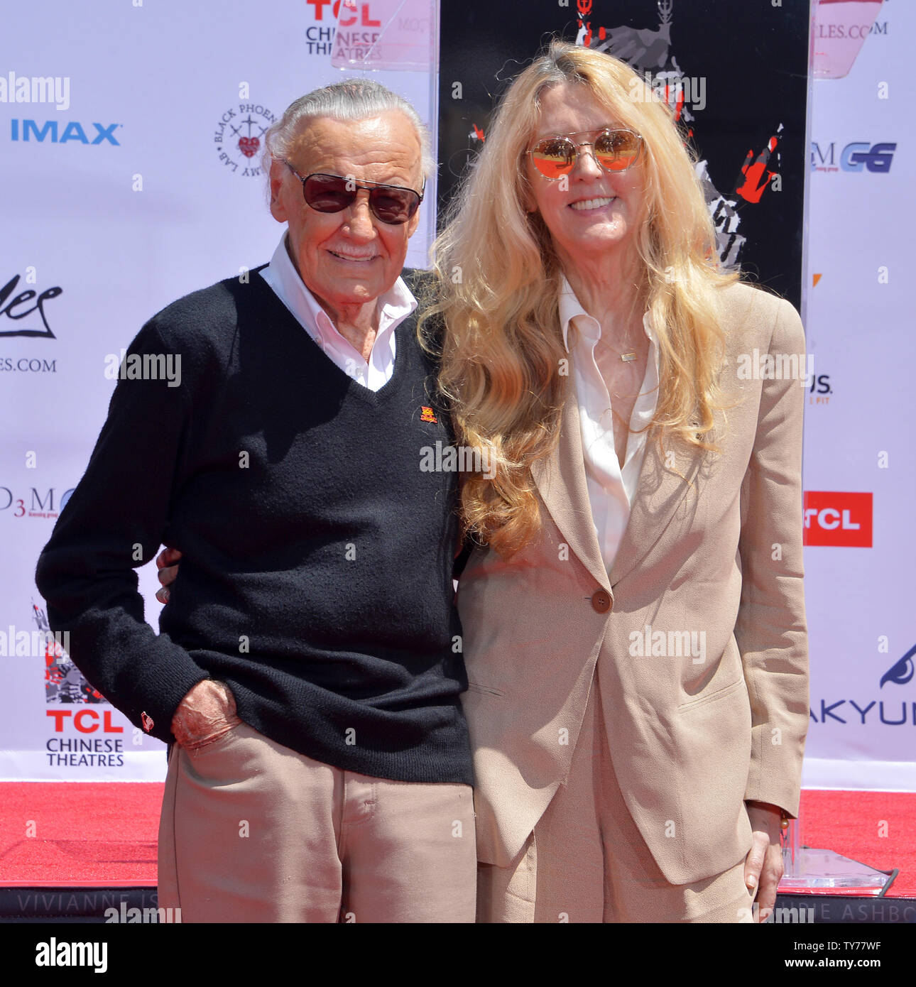 Marvel comic book writer Stan Lee and his daughter . Lee participate in  a hand and footprint ceremony immortalizing him in the forecourt of TCL  Chinese Theatre (formerly Grauman's) in the Hollywood