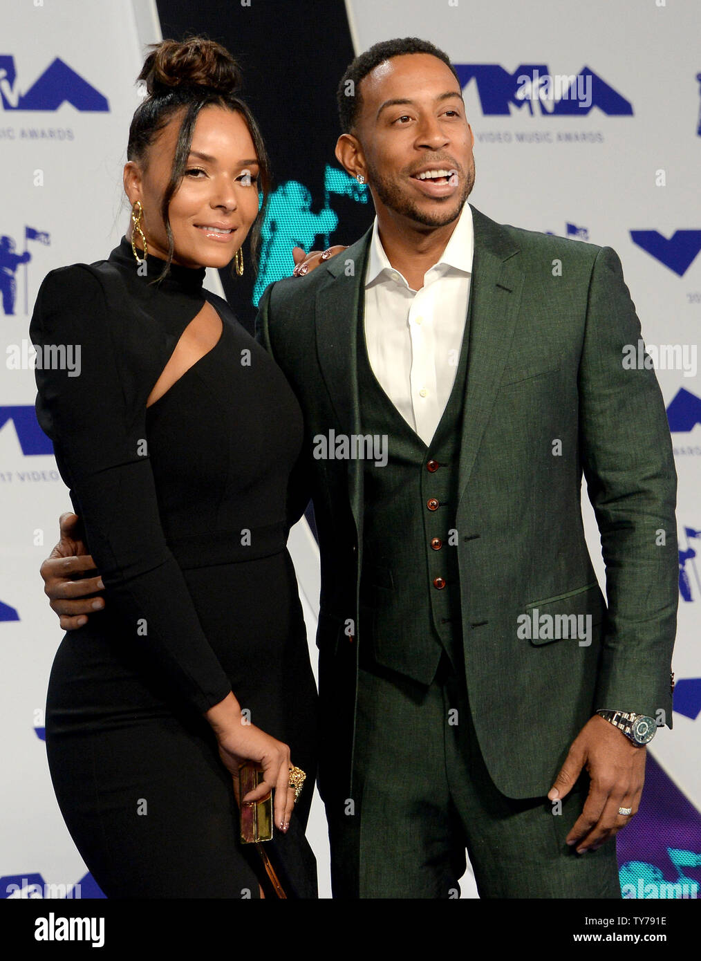 (L-R) Eudoxie Mbouguiengue and Ludacris arrive for the 34th annual MTV