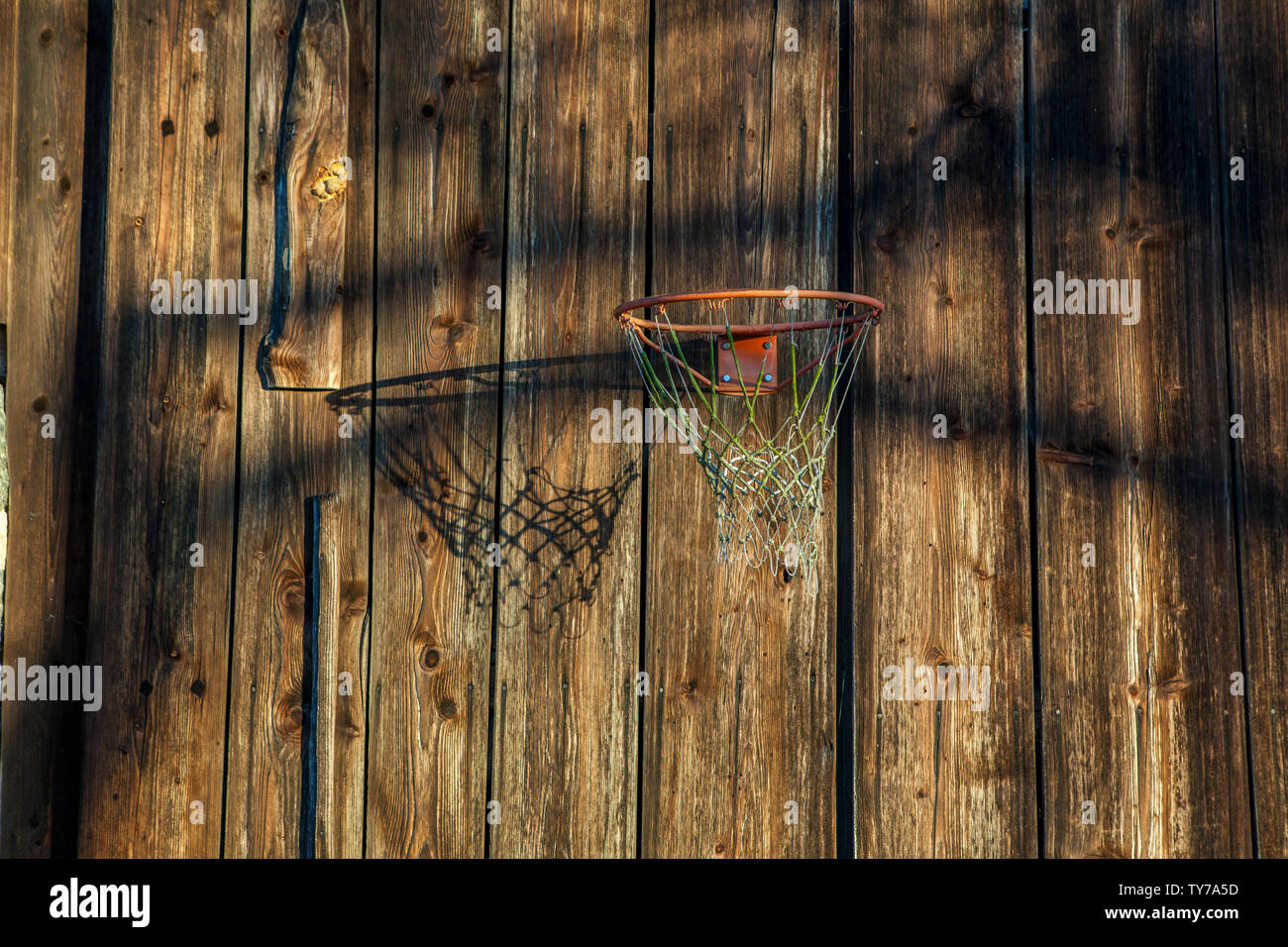 wooden rocking horse swinging at a colorful playground Stock Photo