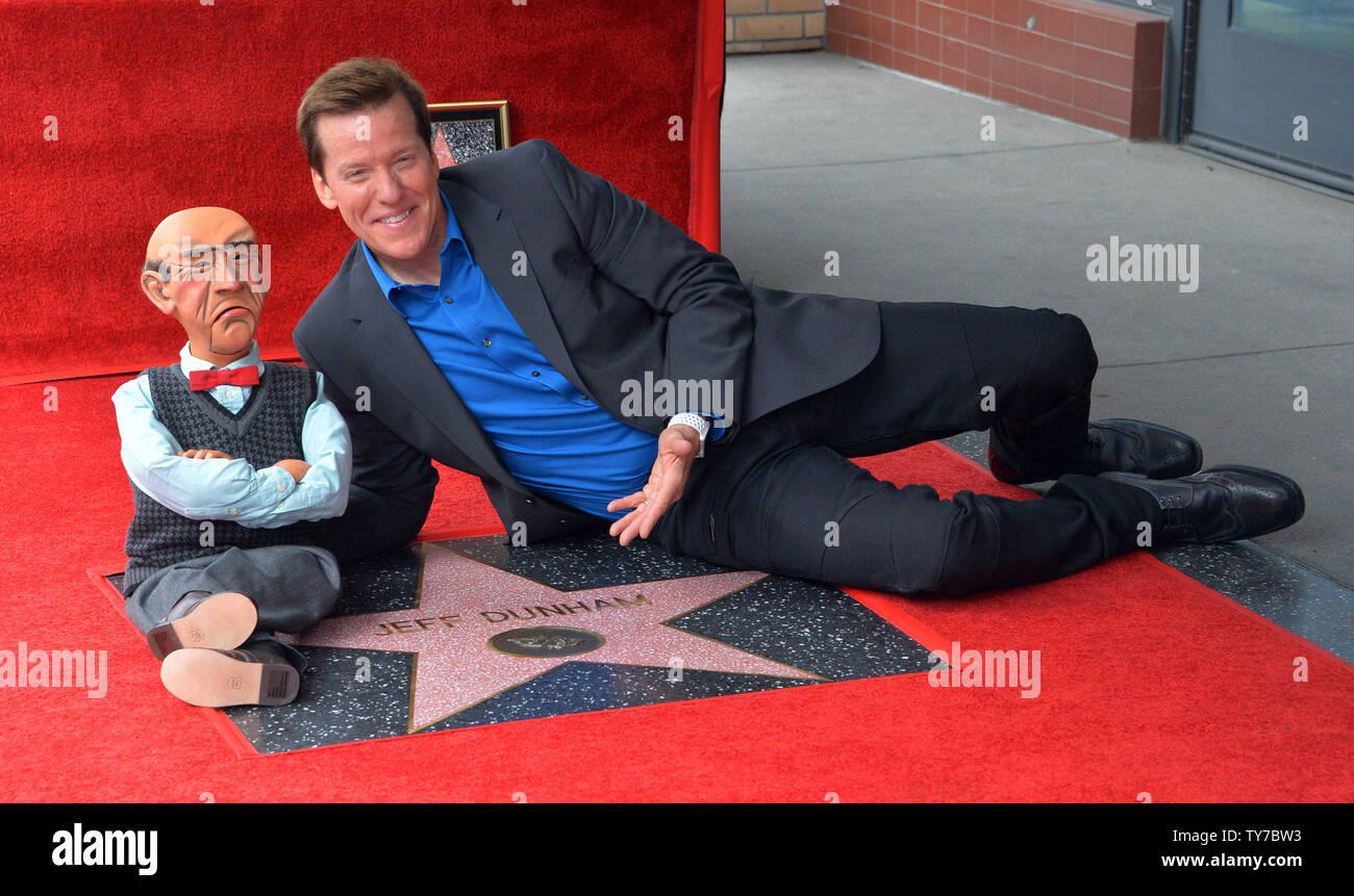 American ventriloquist and comedian Jeff Dunham and his puppet Walter strike a pose during an