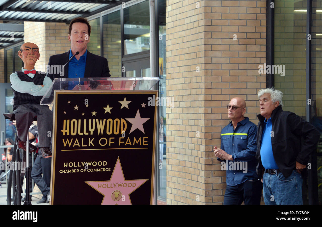 American ventriloquist and comedian Jeff Dunham makes comments as Howie Mandel (C) and Jay Leno