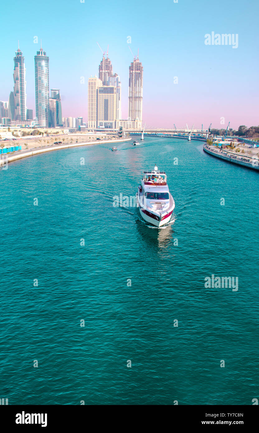 Boat ride from Dubai water canal famous tourist attraction tolerance bridge  best place to spend holidays Stock Photo