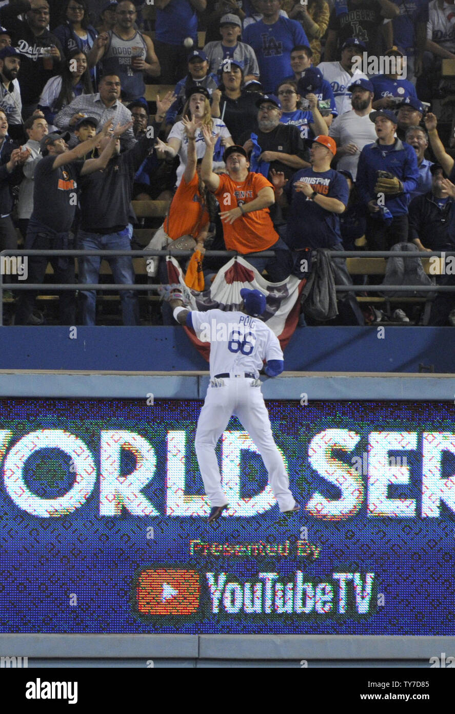 Los Angeles Dodgers right fielder Yasiel Puig (66) climbs the wall in a fruitless attempt to catch a home run by Houston Astros George Springer in the third inning of the 2017 MLB World Series game six at Dodger Stadium in Los Angeles on October 31, 2017. The Astros lead the Dodgers 3-2 in the best of seven game series.   Photo byLori Shepler/UPI Stock Photo