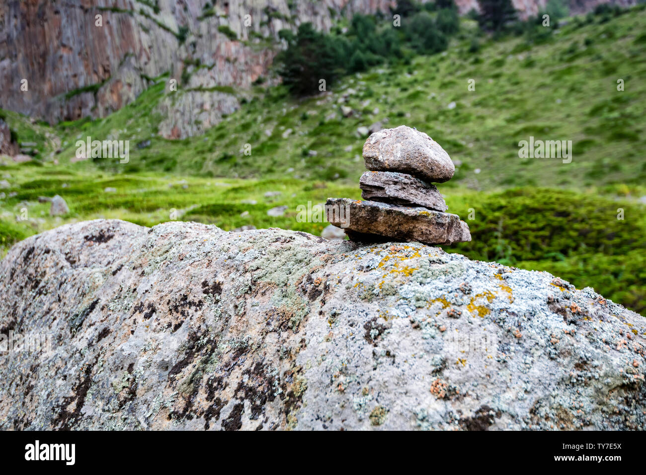 Stone tower of small rocks made in beautiful mountains Stock Photo - Alamy