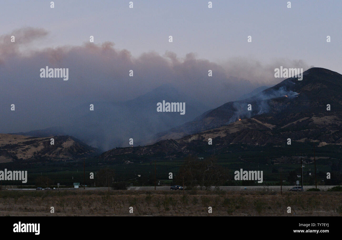 Smoke from the Thompson fire hovers during the early morning hours in