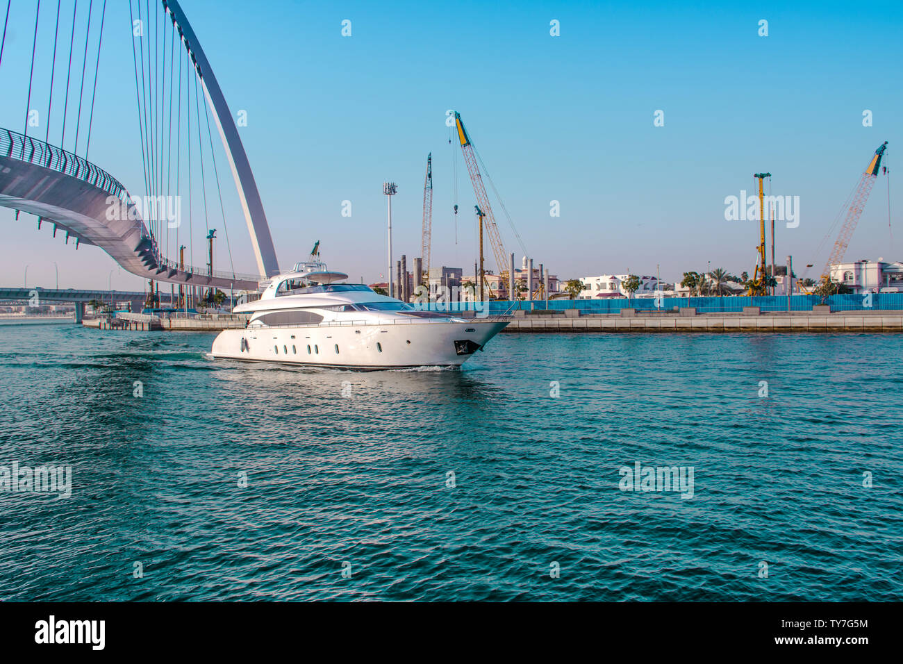 Yacht ride from Dubai water canal famous tourist attraction tolerance bridge  best place to spend holidays Stock Photo