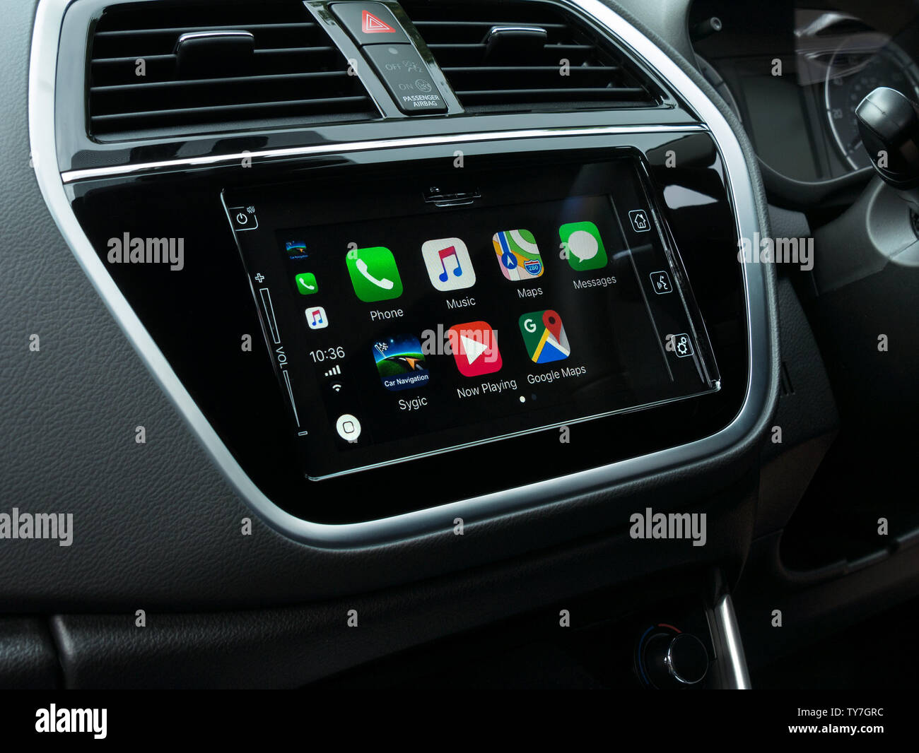 IOS 12 Apple CarPlay home screen menu on Bosch in car dashboard Satnav infotainment head unit in Suzuki S-Cross SX4 vehicle. Stock Photo