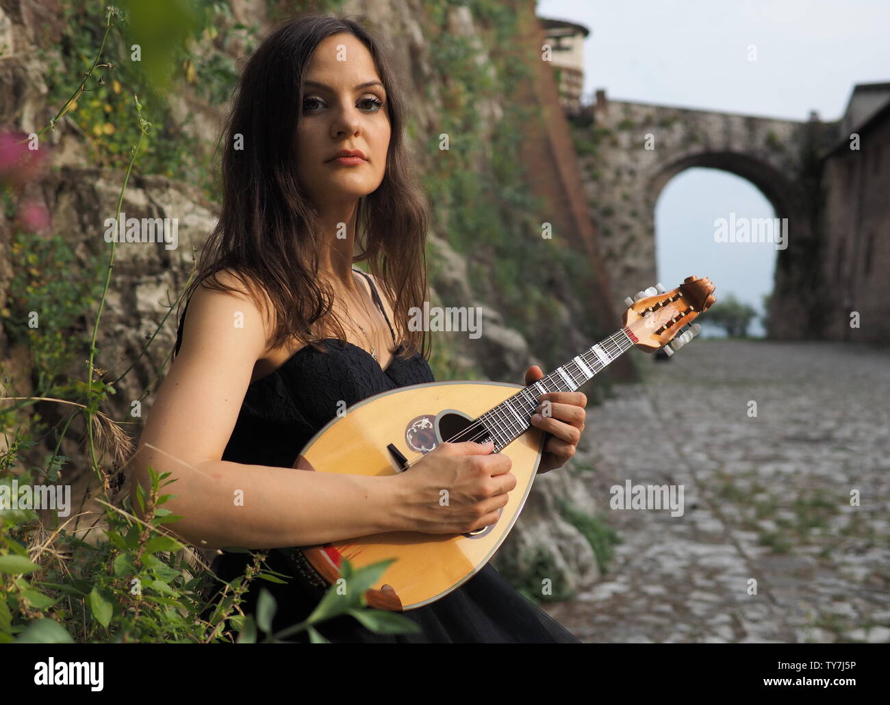 Musician posing with beautiful italian mandolin Stock Photo Alamy