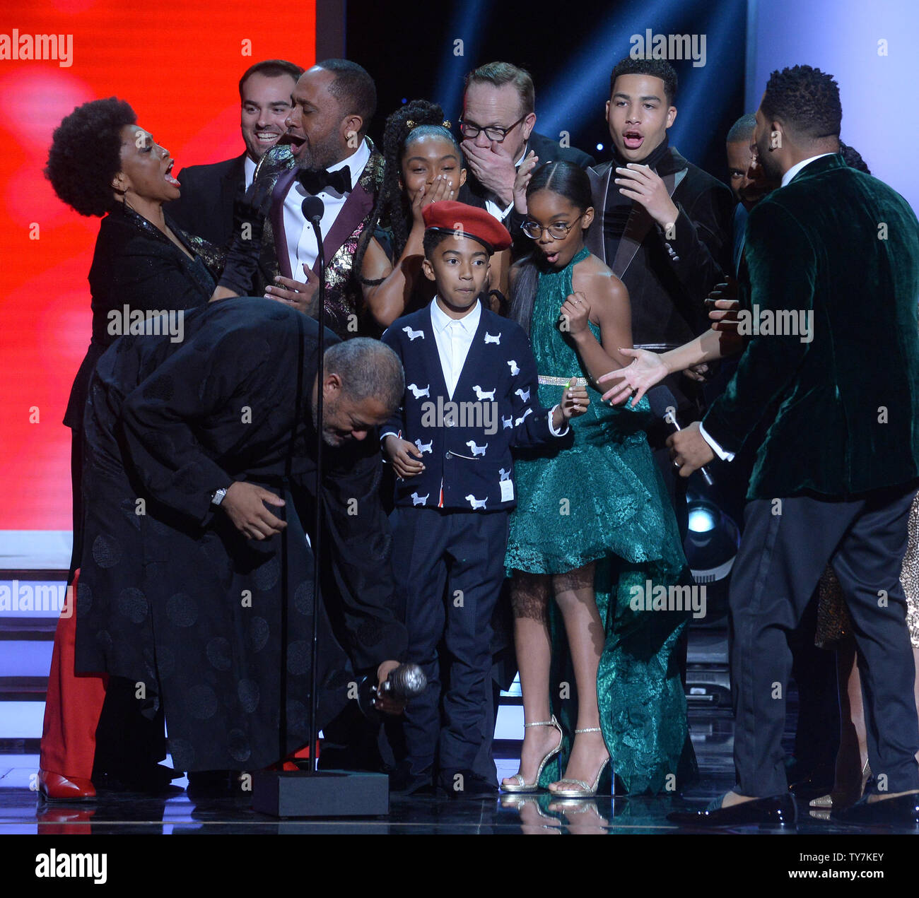 Jenifer Lewis, Kenya Barris, Miles Brown, Yara Shahidi, Marsai Martin, Marcus Scribner, and Anthony Anderson react after their trophy for the Outstanding Comedy Series award for 'black-ish' was dropped onstage during the 49th NAACP Image Awards at the Pasadena Civic Auditorium in Pasadena, California on January 15, 2018. The NAACP Image Awards celebrates the accomplishments of people of color in the fields of television, music, literature and film and also honors individuals or groups who promote social justice through creative endeavors.during the 49th NAACP Image Awards at the Pasadena Civic Stock Photo