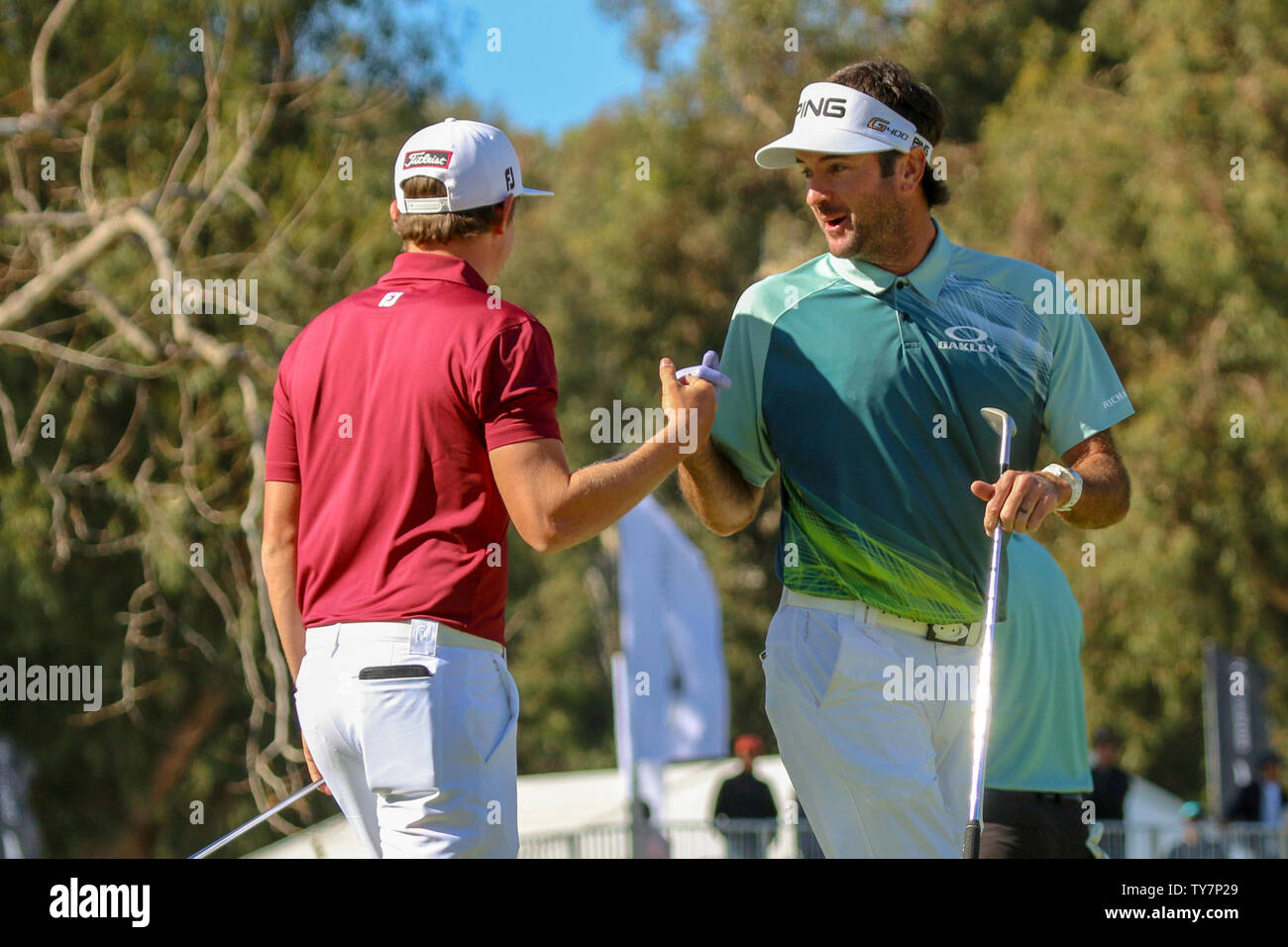 Cameron Smith congratulates Bubba Watson after his birdie on the 14th during the final round of the Genesis Open at Riviera Country Club in Los Angeles, California on February 18, 2018. Bubba Watson would win the Genesis Open Championship with a score of -12. Photo by Howard Shen/UPI Stock Photo