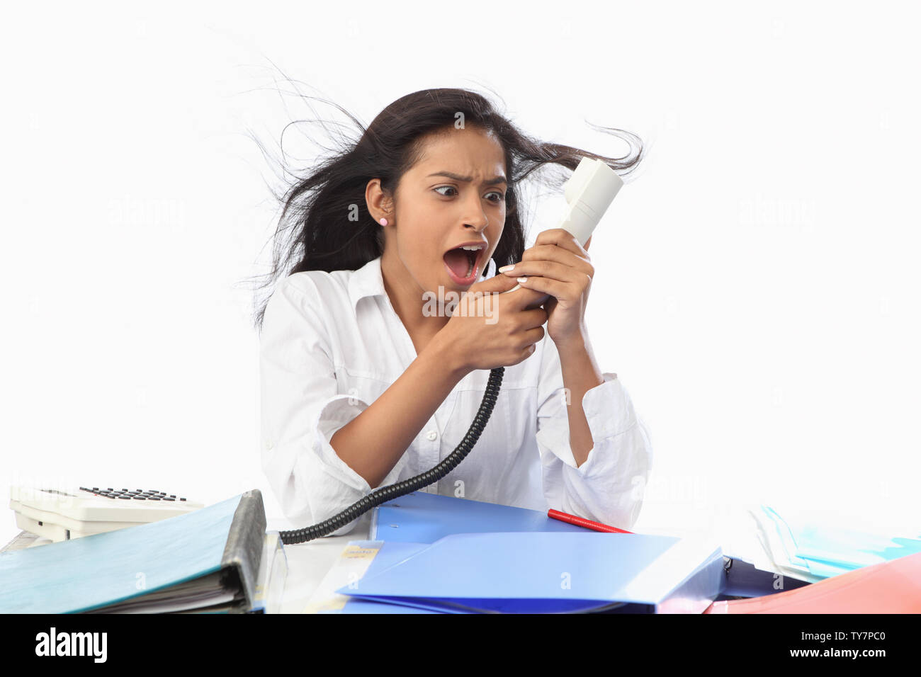 Businesswoman shouting on a telephone Stock Photo