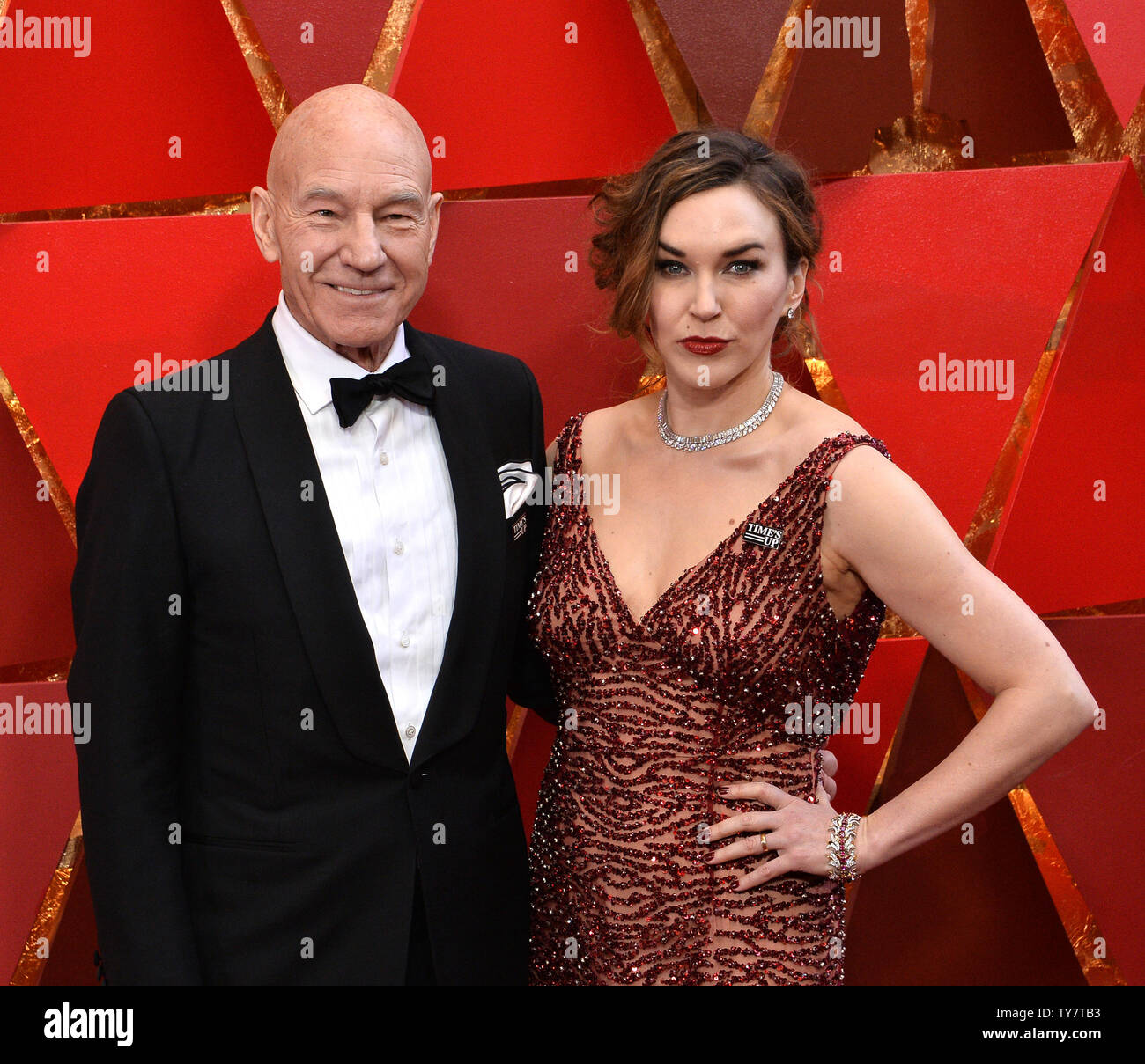 Actor Sir Patrick Stewart And His Wife Singer Sunny Ozell Arrive On The Red Carpet For The 90th Annual Academy Awards At The Dolby Theatre In The Hollywood Section Of Los Angeles