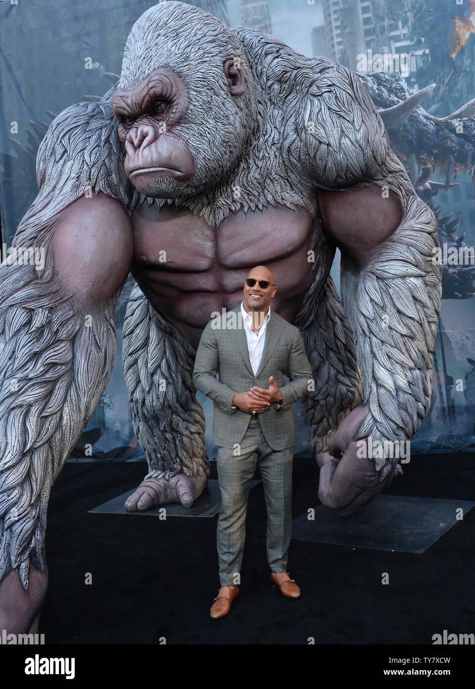 Cast member Dwayne Johnson attends the premiere of the sci-fi motion picture 'Rampage' at the Microsoft Theater in downtown Los Angeles on April 4, 2018. Storyline: The film follows a primatologist who must team-up with George, an albino gorilla who turns into a raging creature of enormous size following a rogue experiment, in order to stop an invasion of monsters.  Photo by Jim Ruymen/UPI Stock Photo