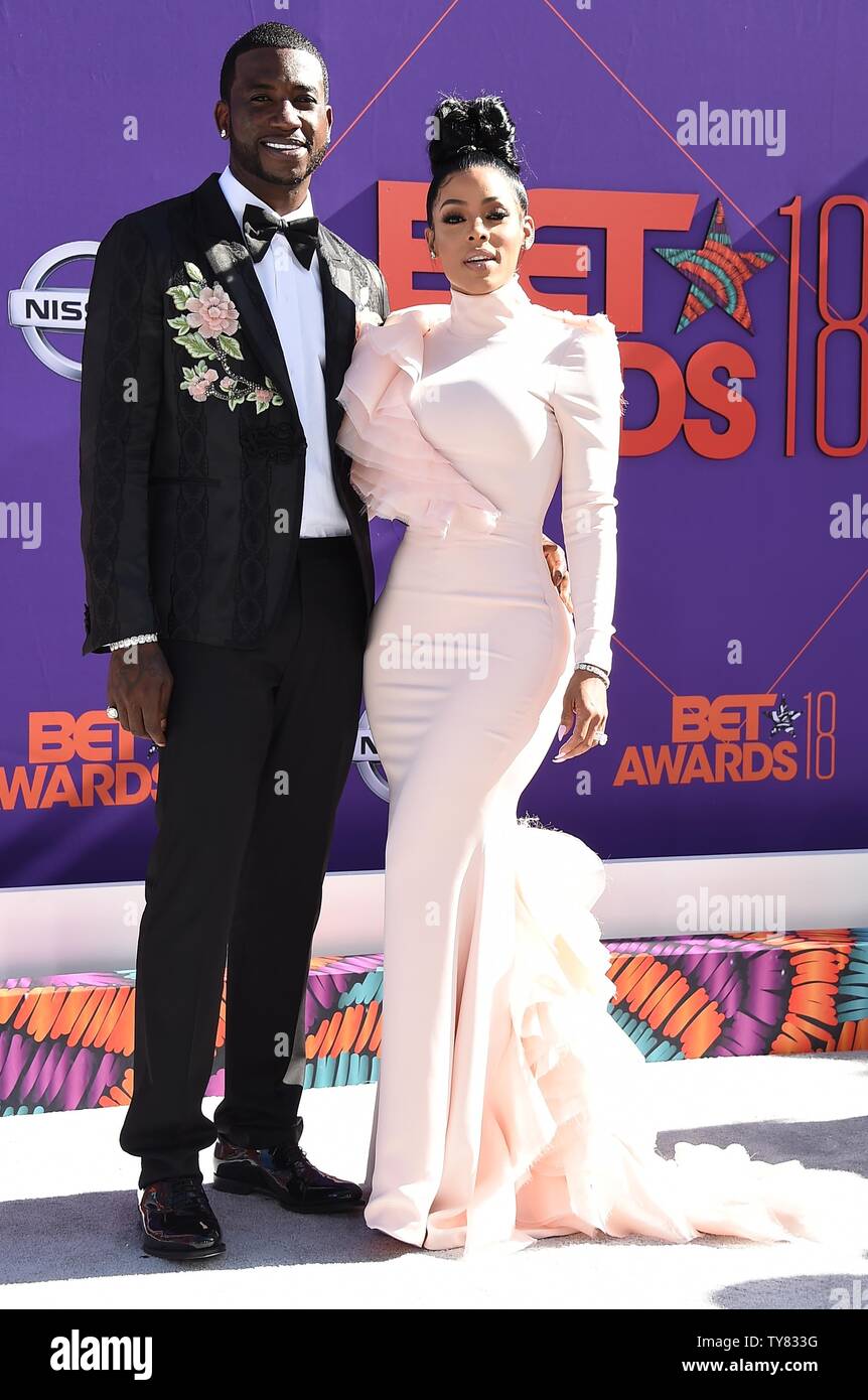 Rapper Gucci Mane (L) and model Keyshia Ka'Oir attend the 18th annual BET  Awards at Microsoft Theater in Los Angeles on June 24, 2018. The ceremony  celebrates achievements in entertainment and honors