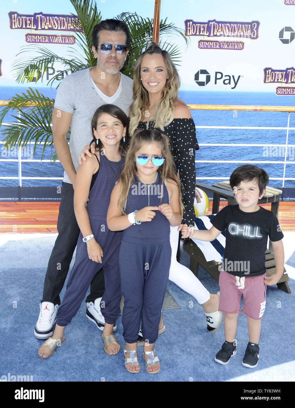 Guests Teddi Mellencamp Arroyave, husband Edwin Arroyave, son Cruz, daughters Slate and Isabella  attend the premiere of the animated motion picture comedy 'Hotel Transylvania 3: Summer Vacation' at the Regency Village Theatre in Los Angeles on June 30, 2018. The story follows Mavis as she surprises Dracula with a family voyage on a luxury Monster Cruise Ship so he can take a vacation from providing everyone else's vacation at the hotel. The rest of Drac's Pack cannot resist going along. But once they leave port, romance arises when Dracula meets the mysterious ship Captain, Ericka.   Photo by Stock Photo