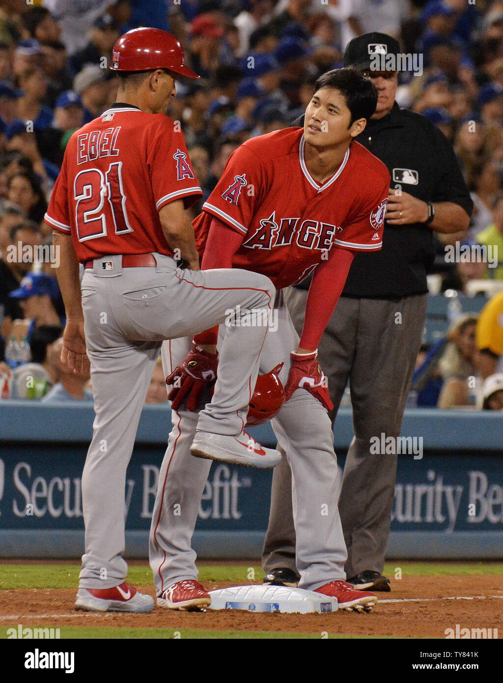 los-angeles-angels-shohei-ohtani-confers-with-third-base-coach-dino-ebel-after-connecting-with-a-one-hopper-over-the-left-center-wall-for-a-double-as-a-pinch-hitter-in-the-ninth-inning