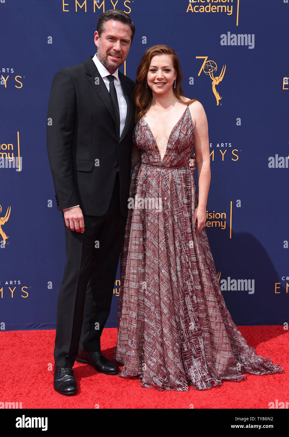 (L-R) Actor Alexis Denisof and actress Alyson Hannigan attend the