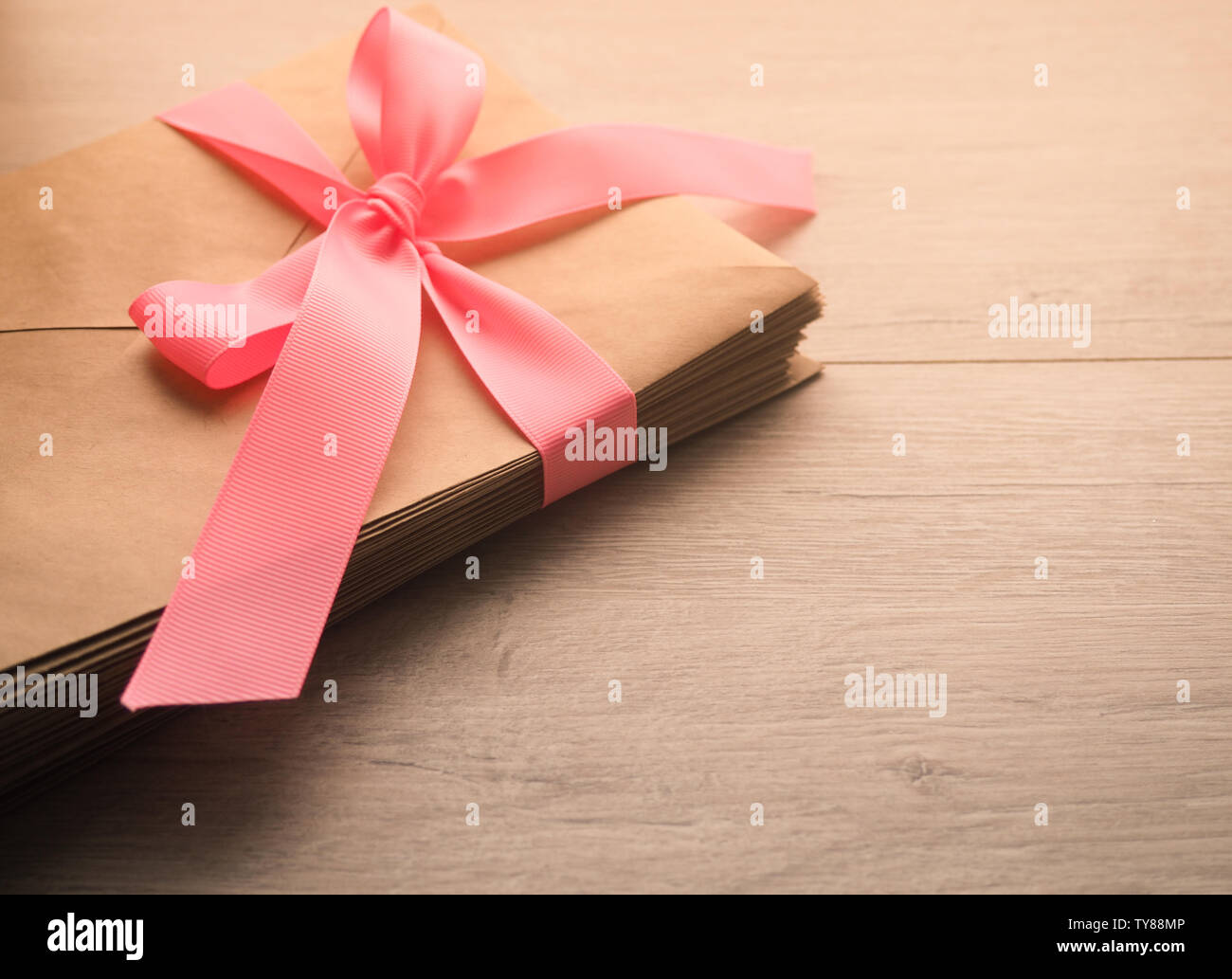 Gift envelope on the wooden floor, Homemade gift envelope Stock Photo