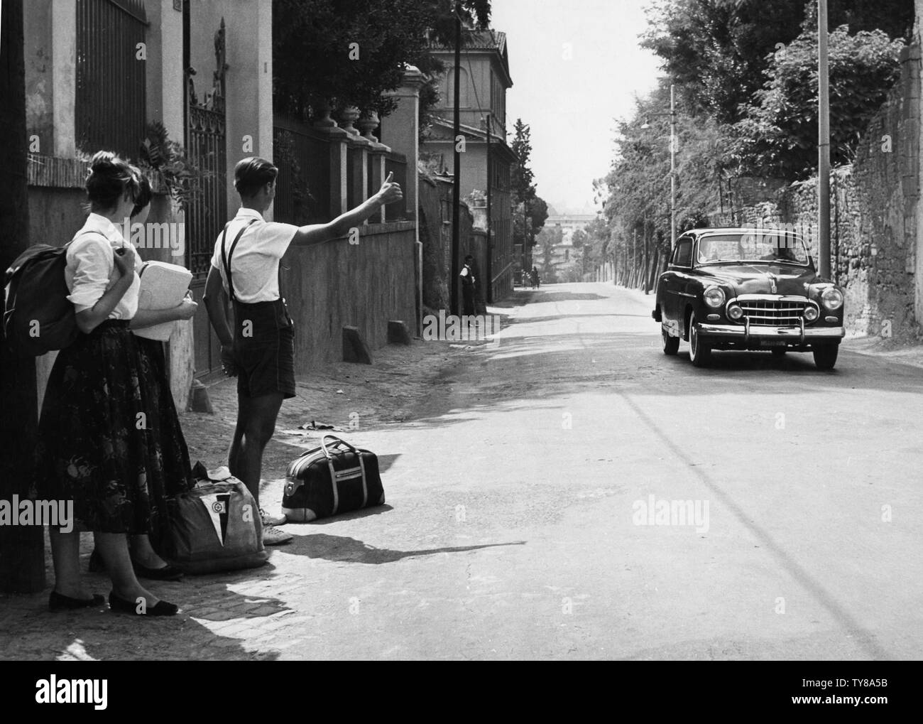 Rome, young tourists hitchhike on the Via Cassia, 1960 Stock Photo