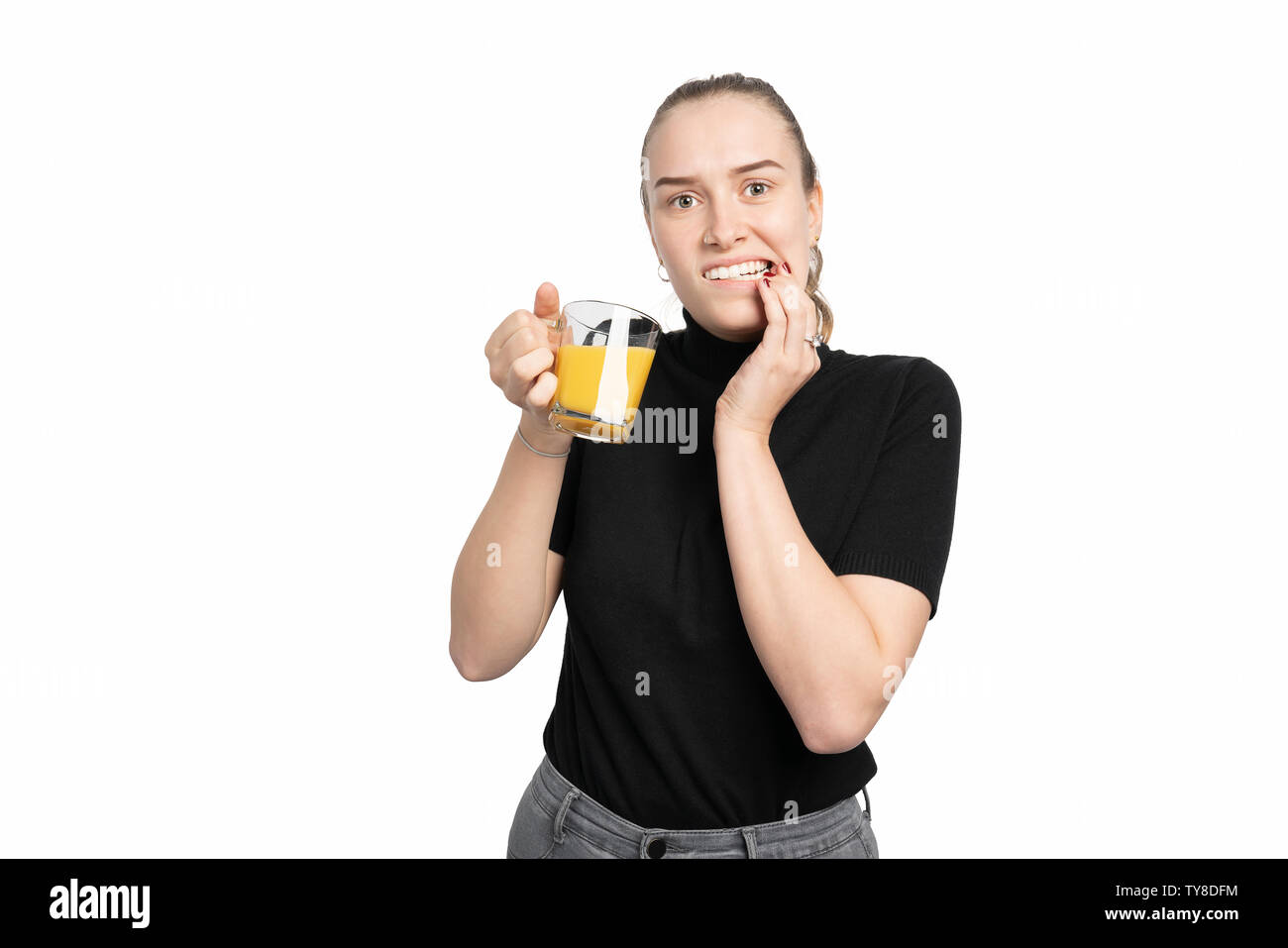 Young woman is cold sensitive when drinking cold drinks Stock Photo