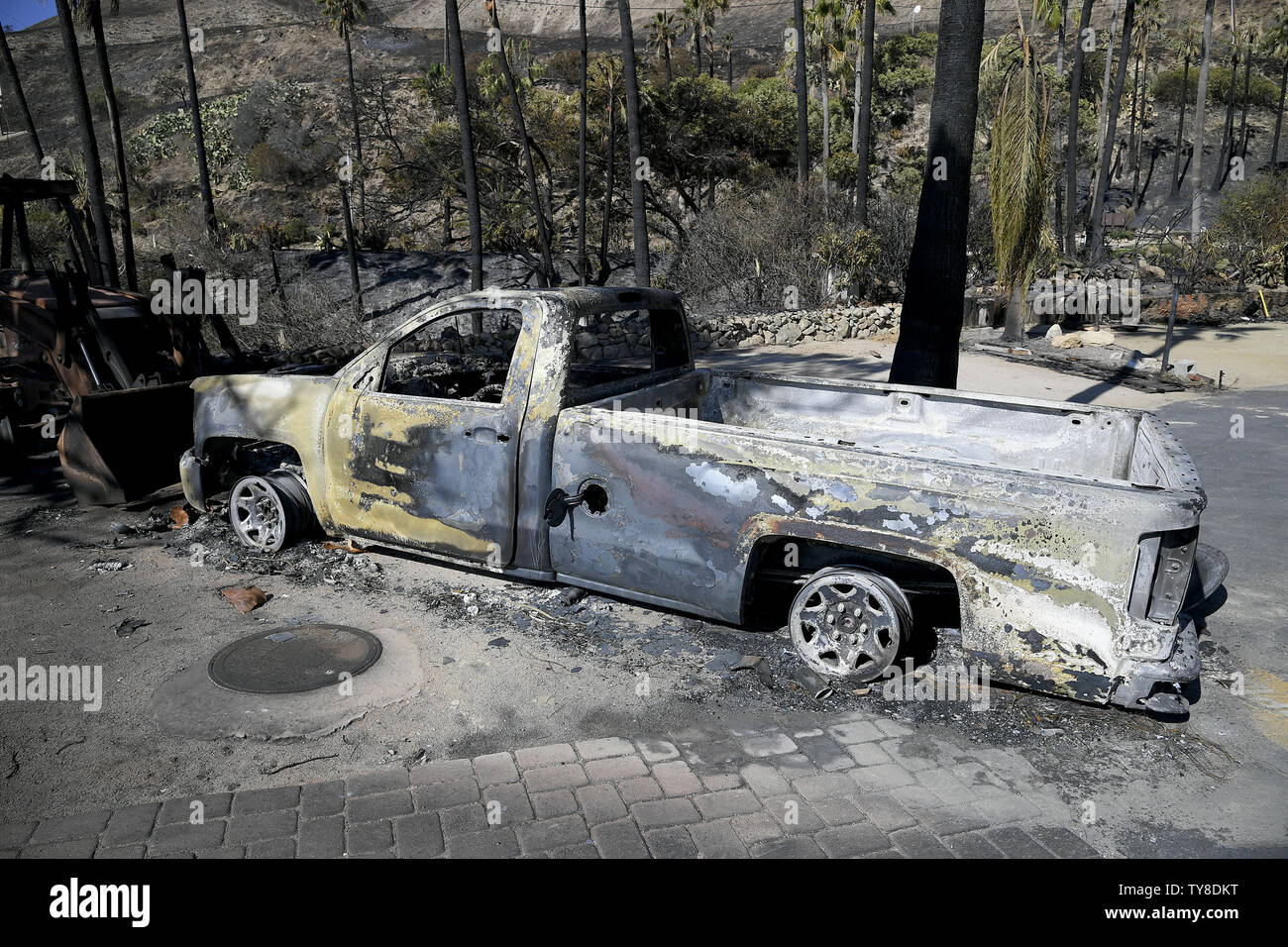 Image result for image of charred reamins of a yellow pick up truck