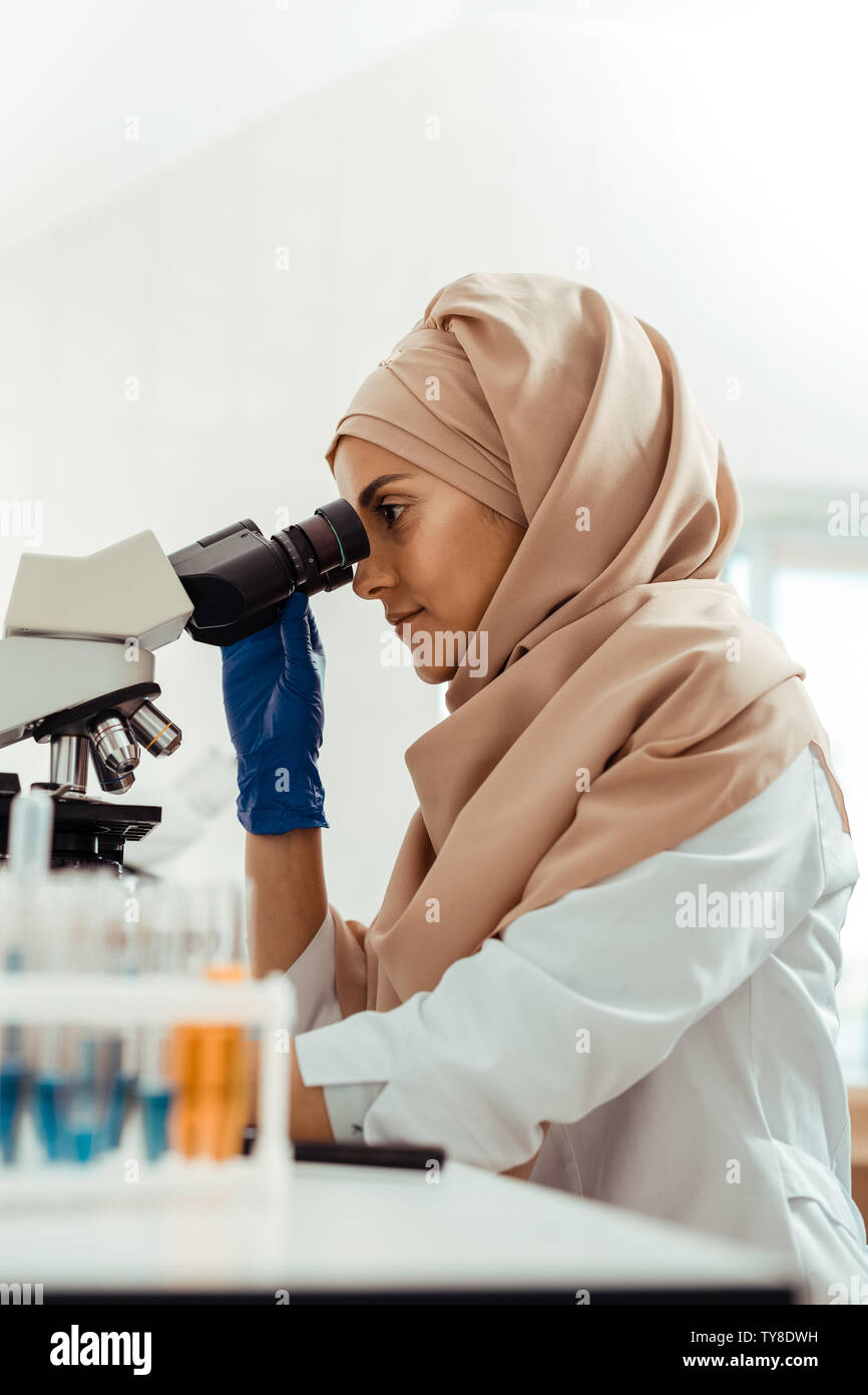 Nice muslim woman thinking about her research Stock Photo