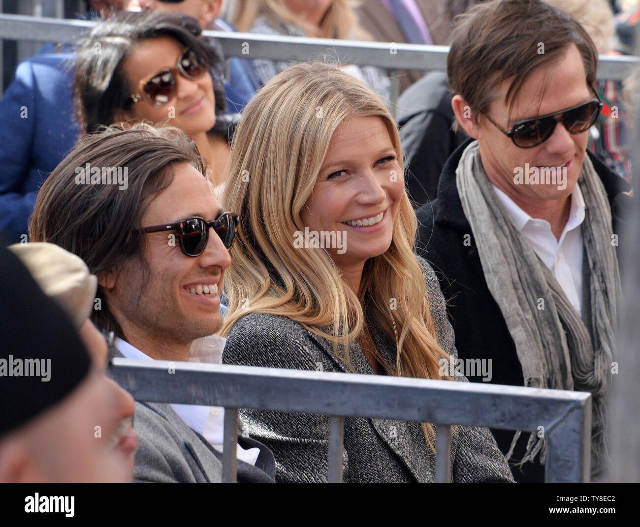 Actress Paltrow (C) and her husband, producer Brad Falchuk (L