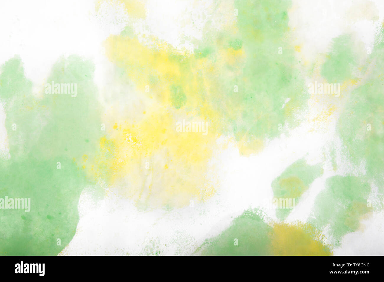 Light yellow and light green abstract watercolor dye art background ...