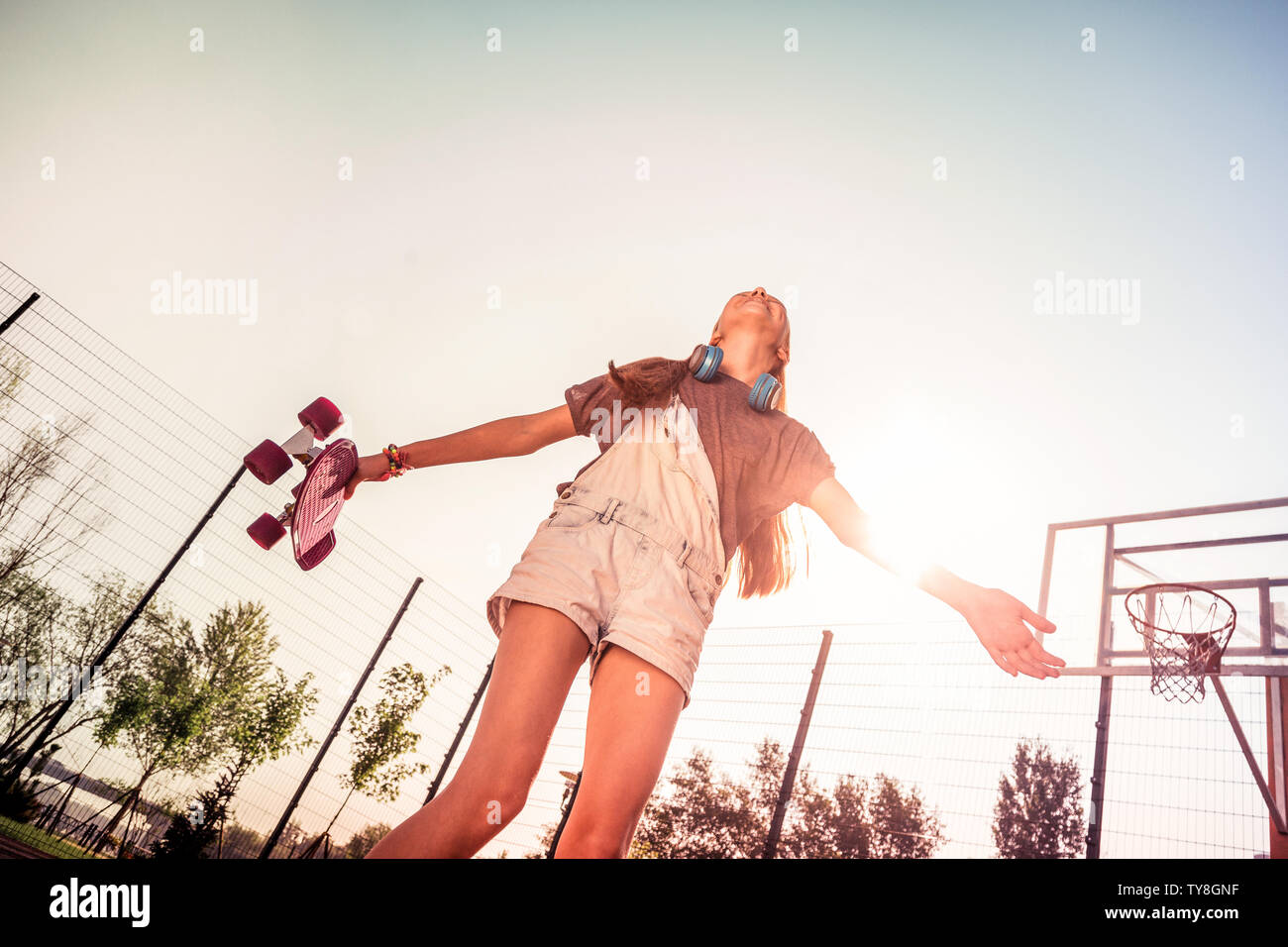 Laughing dark-haired girl enjoying pleasant summer day Stock Photo