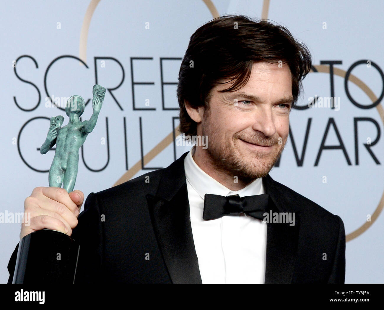Jason Bateman appears backstage with the award for Outstanding