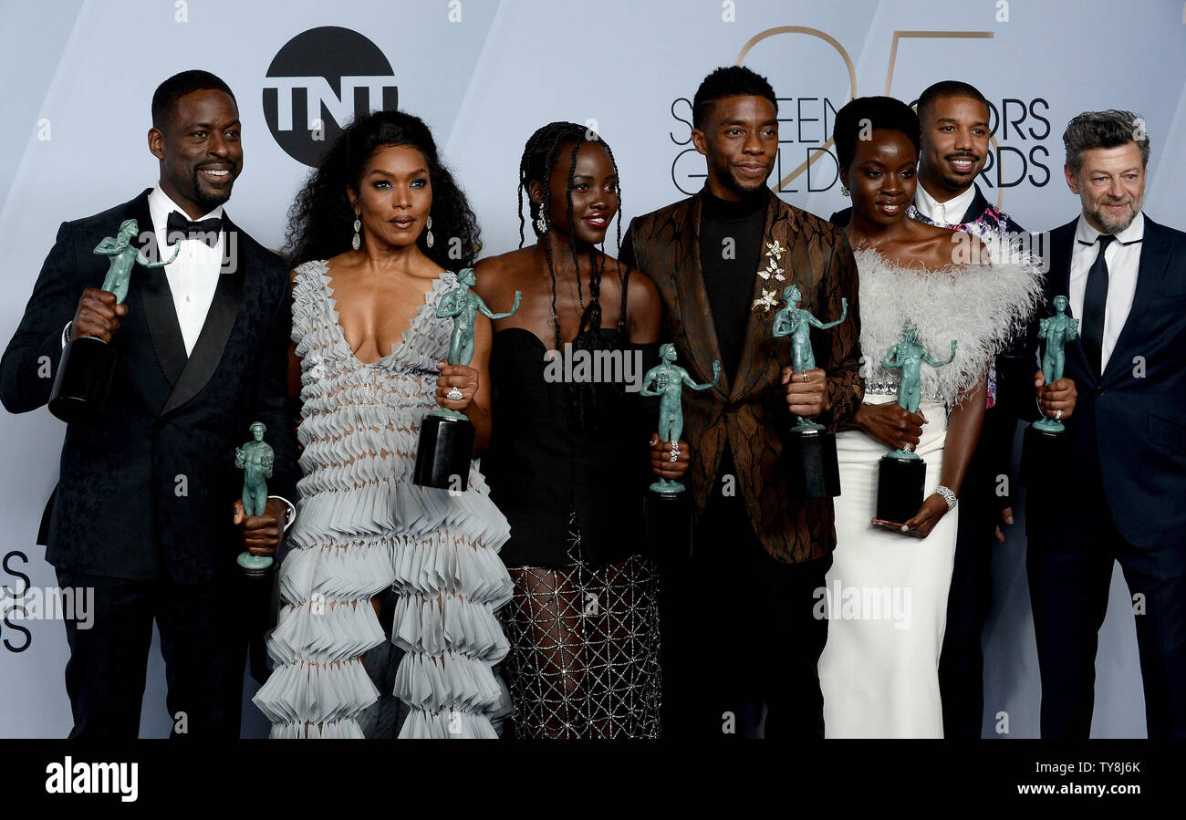 L-R) Sterling K. Brown, winner of Outstanding Performance by a Cast in a  Motion Picture for 'Black Panther' and Outstanding Performance by an  Ensemble in a Drama Series for 'This Is Us,'