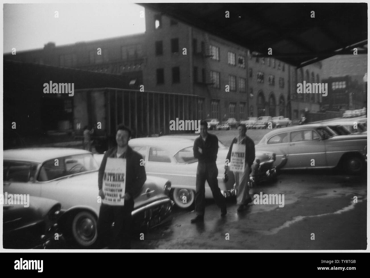 Men Picketing Brown Shoe Company. St. Louis; Scope and content:  Picketers are identified in one photo; the other shows the picket signs the men are wearing. Stock Photo