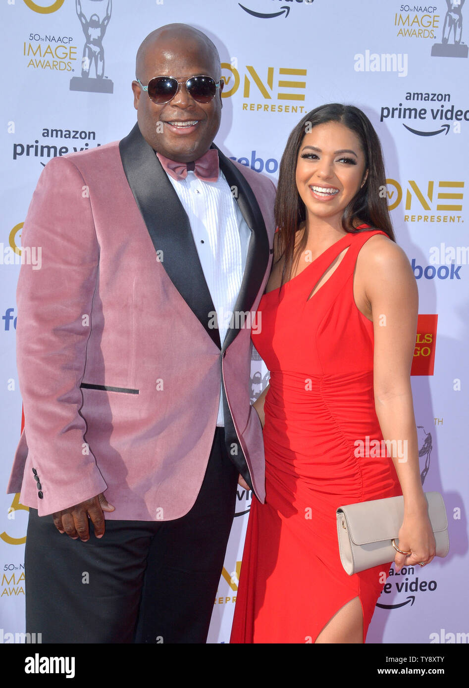 Damien Douglas (L) and Ashley LaRae arrive for the 50th annual NAACP