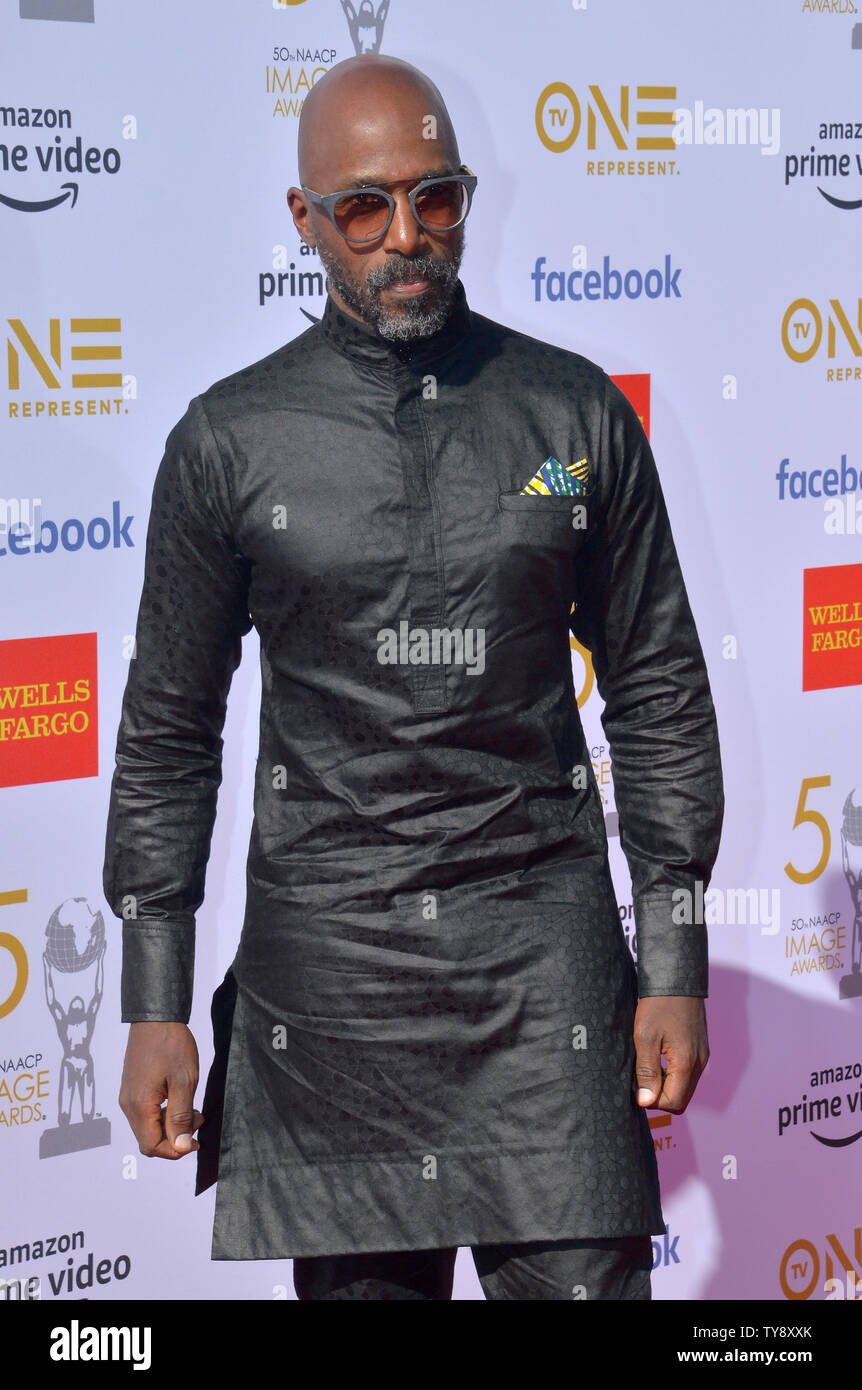 Ntare Guma Mbaho Mwine arrives for the 50th annual NAACP Image Awards at  the Dolby Theatre in the Hollywood section of Los Angeles on March 30,  2019. The NAACP Image Awards celebrates