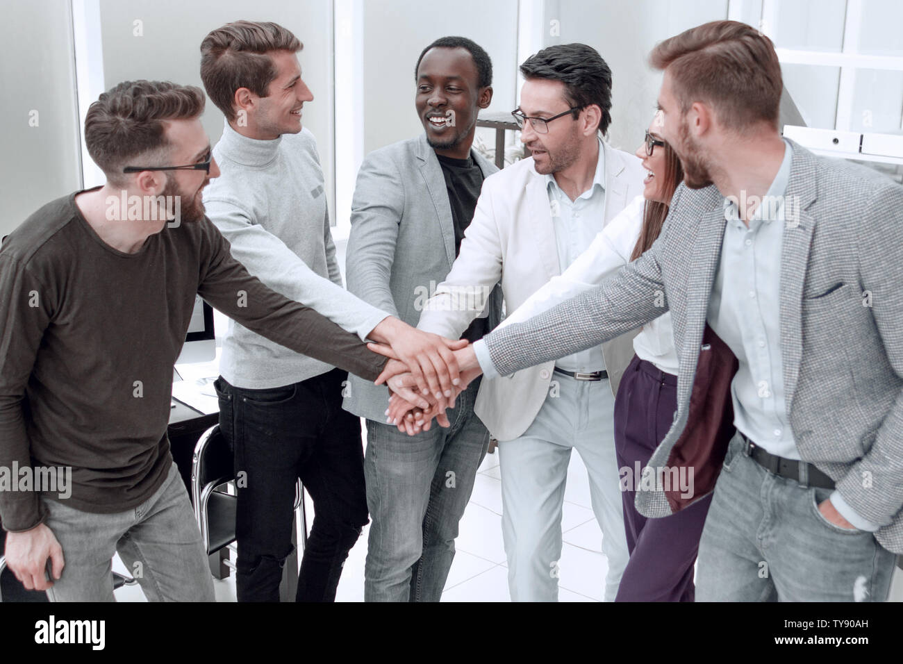 successful business team showing their unity Stock Photo - Alamy
