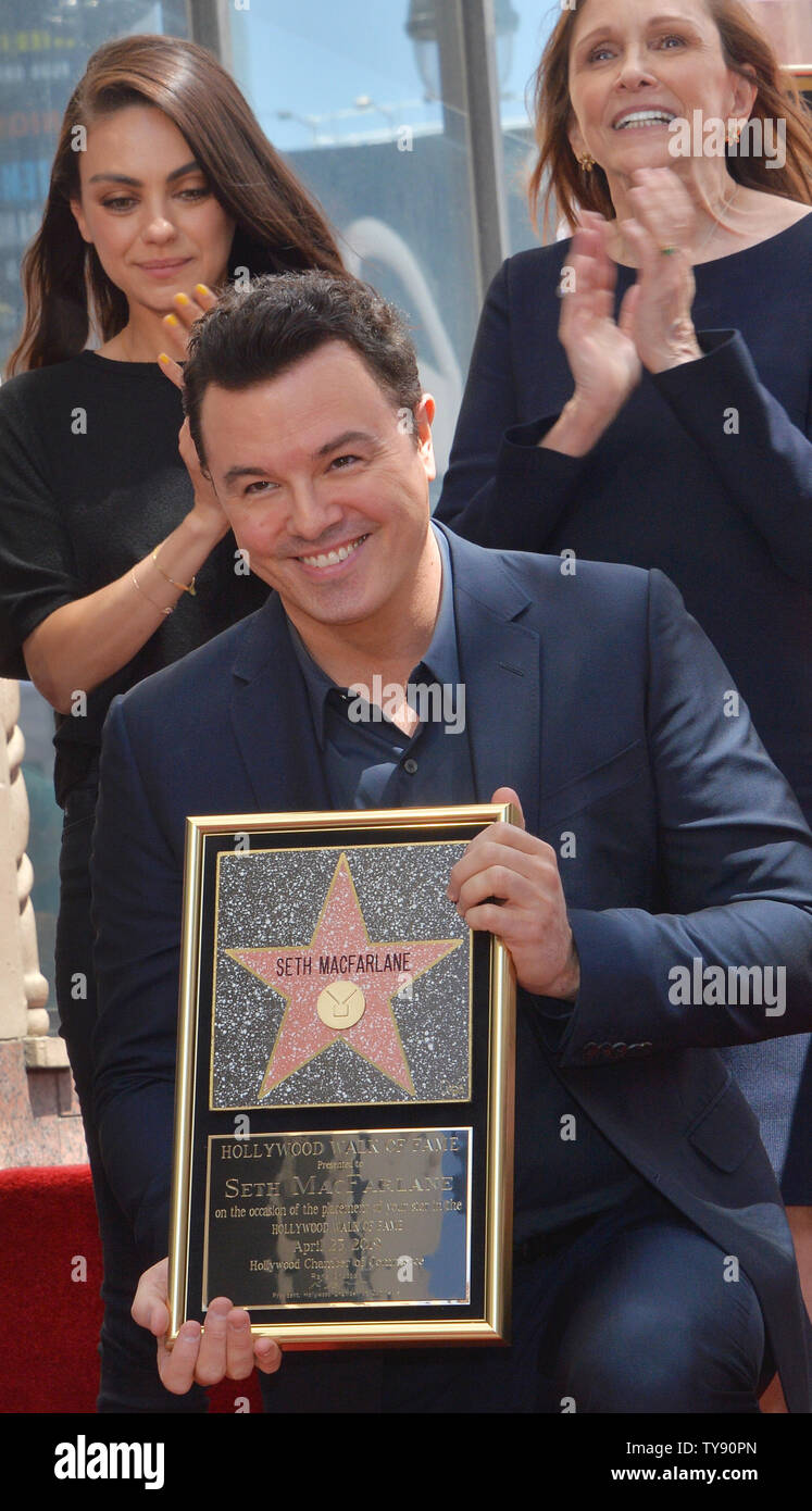 American actor, animator, filmmaker, comedian, and singer Seth MacFarlane holds a replica plaque during an unveiling ceremony honoring him with the 2,661st star on the Hollywood Walk of fame in Los Angeles on April 23, 2019. Working primarily in animation and comedy, as well as live-action and other genres, MacFarlane is the creator of the TV series Family Guy and The Orville, and co-creator of the TV series American Dad! and The Cleveland Show. Looking on is Mila Kunis (L) and Ann Druyan.  Photo by Jim Ruymen/UPI Stock Photo
